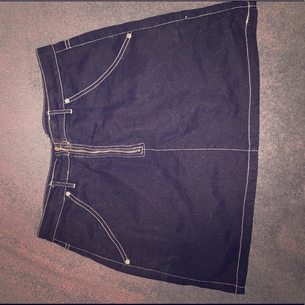 Mini black jean skirt w/ white threading.